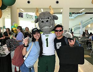 Students posing for a photo with USF Bull mascot